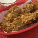 Corn Flake Chicken Tenders in red basket