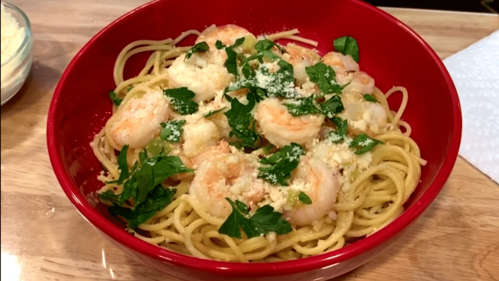 Shrimp scampi in a red bowl