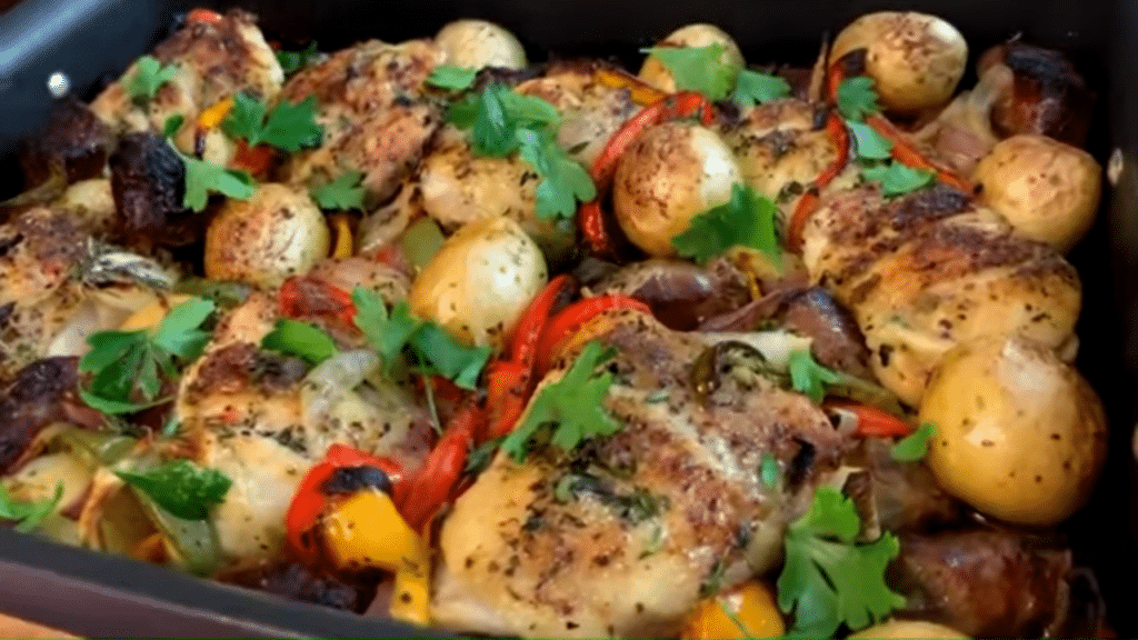 Roasted chicken thighs, sausage, peppers and potatoes