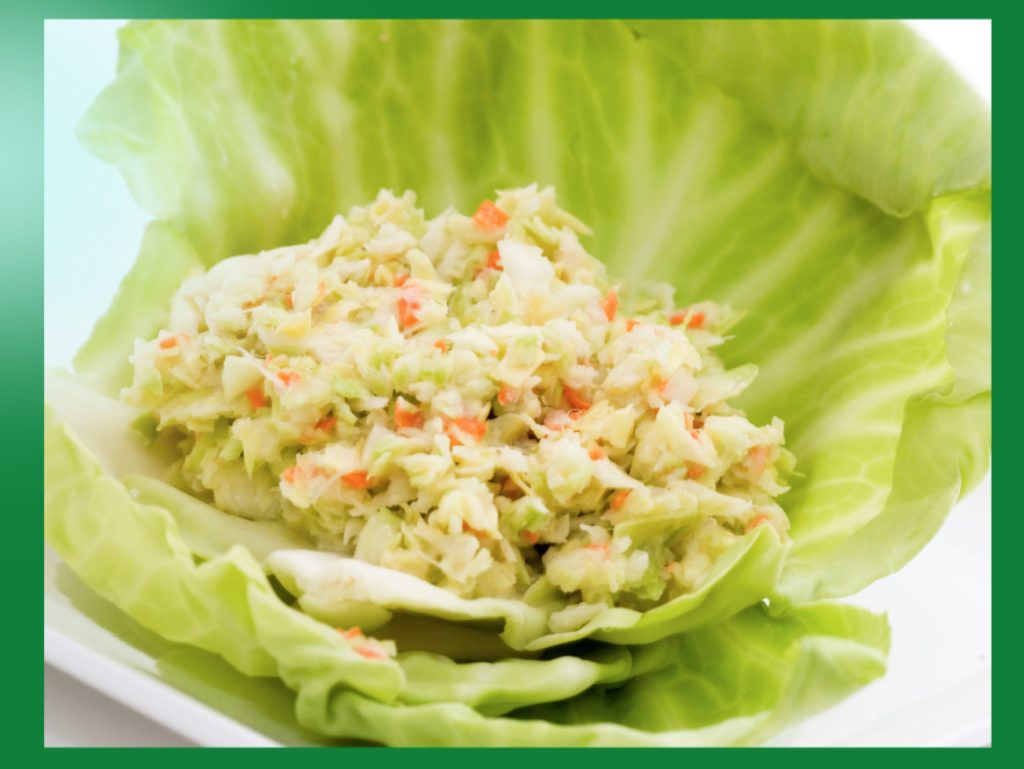 Coleslaw KFC Style on a leaf of lettuce