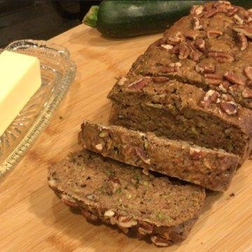 Sliced zucchini bread on bread board