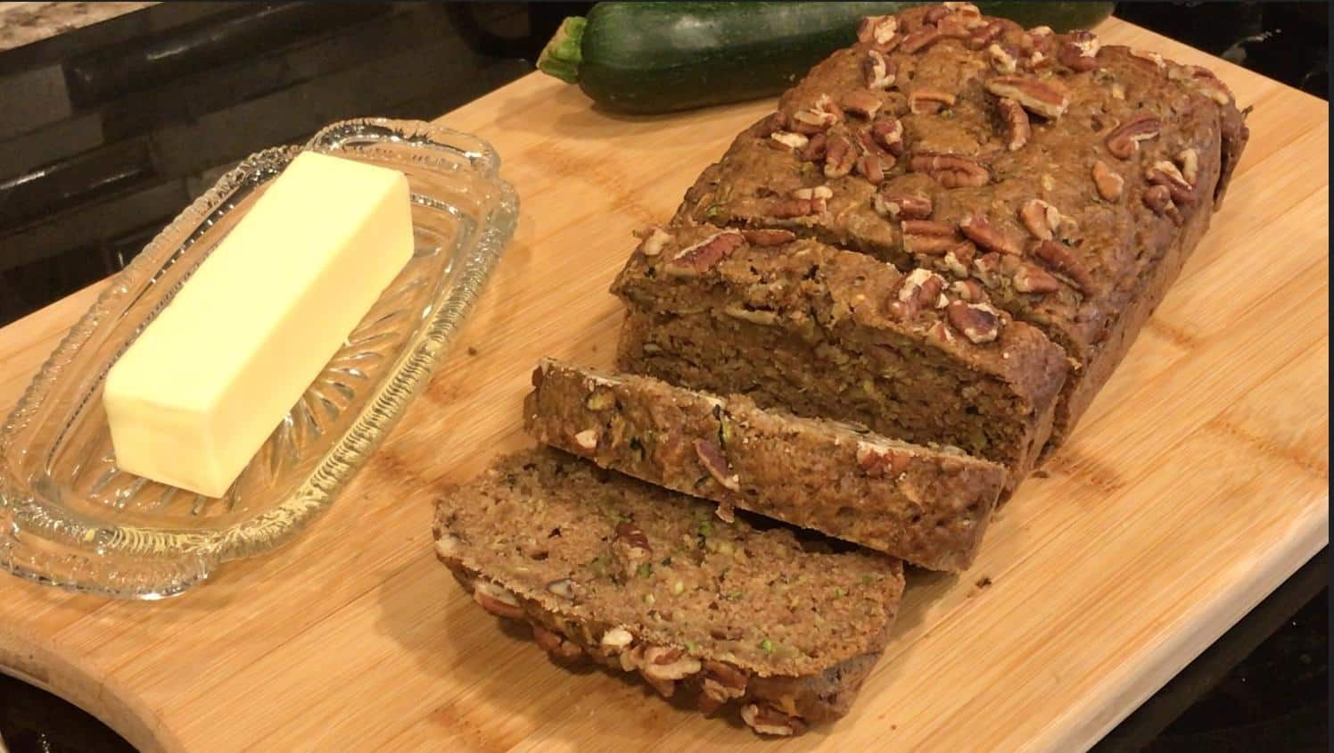 Sliced zucchini bread on bread board