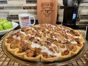 Homemade Apple Crumble Pie on rack