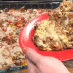 7 Cheese Hamburger Potato Casserole on Red plate
