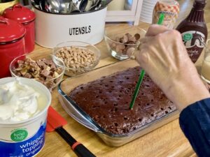 Poking holes in poke cake