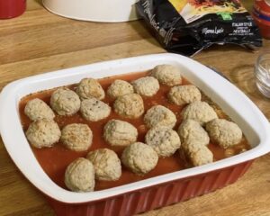 Place meatballs in baking dish