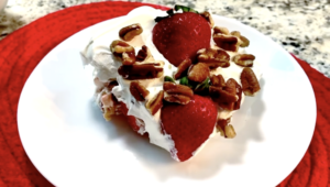 Strawberry Vanilla Icebox Cake with Pecans on a white plate