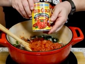 Adding Tomato to pot of Goulash